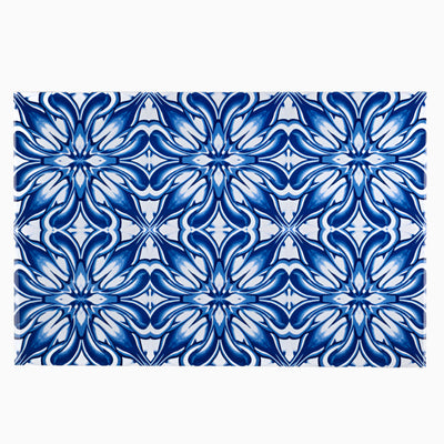 Rectangular tile with blue floral pattern on a white background