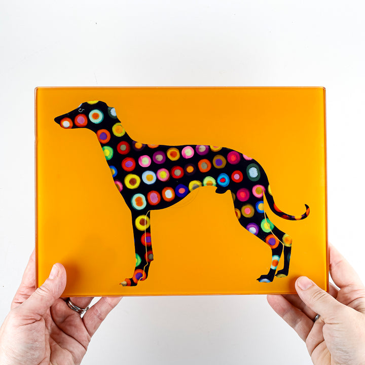 SALE - Spotty Greyhound Small Rectangular Worktop Protector on bright orange